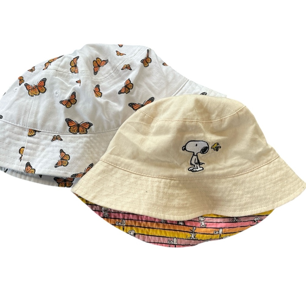 Set of 2 bucket hats.  Butterfly on white and Snoopy on cream.